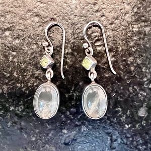 Sterling silver earrings with green stones.